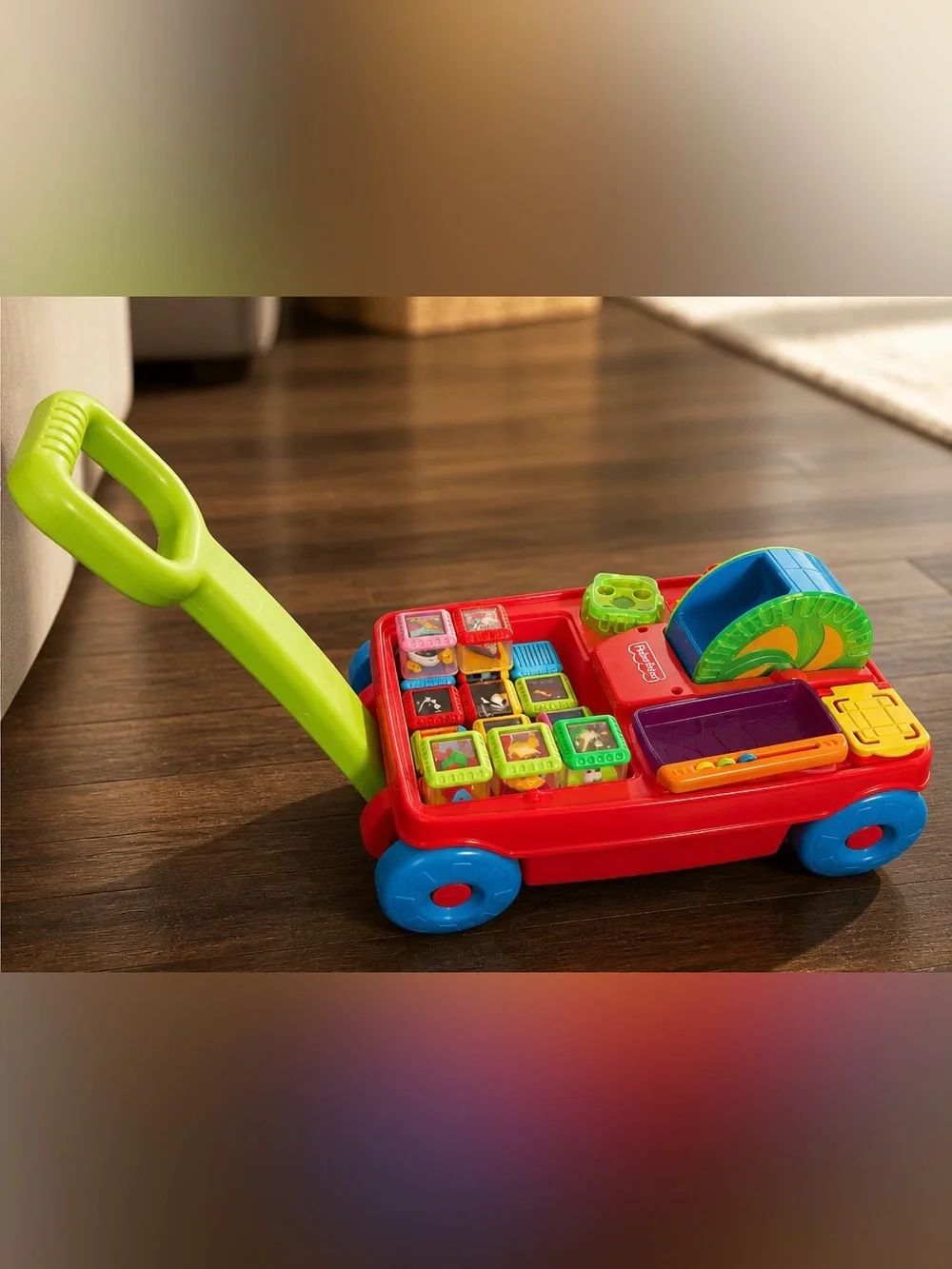 Vintage Fisher-Price Peek-a-boo Pull Toy with Green Handle and Blue Wheels
